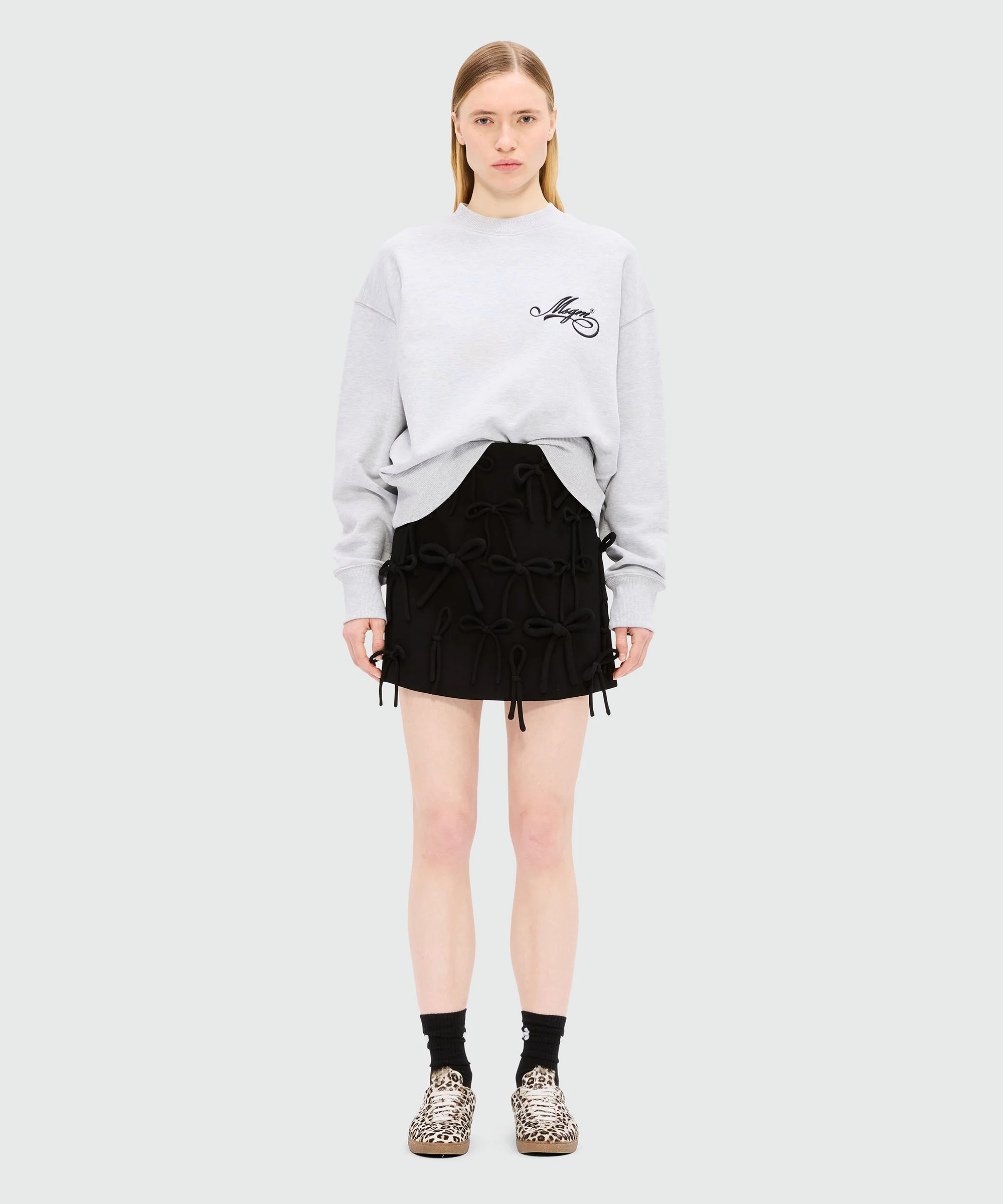 Black miniskirt in double crepe cady with bow detail - Image 2